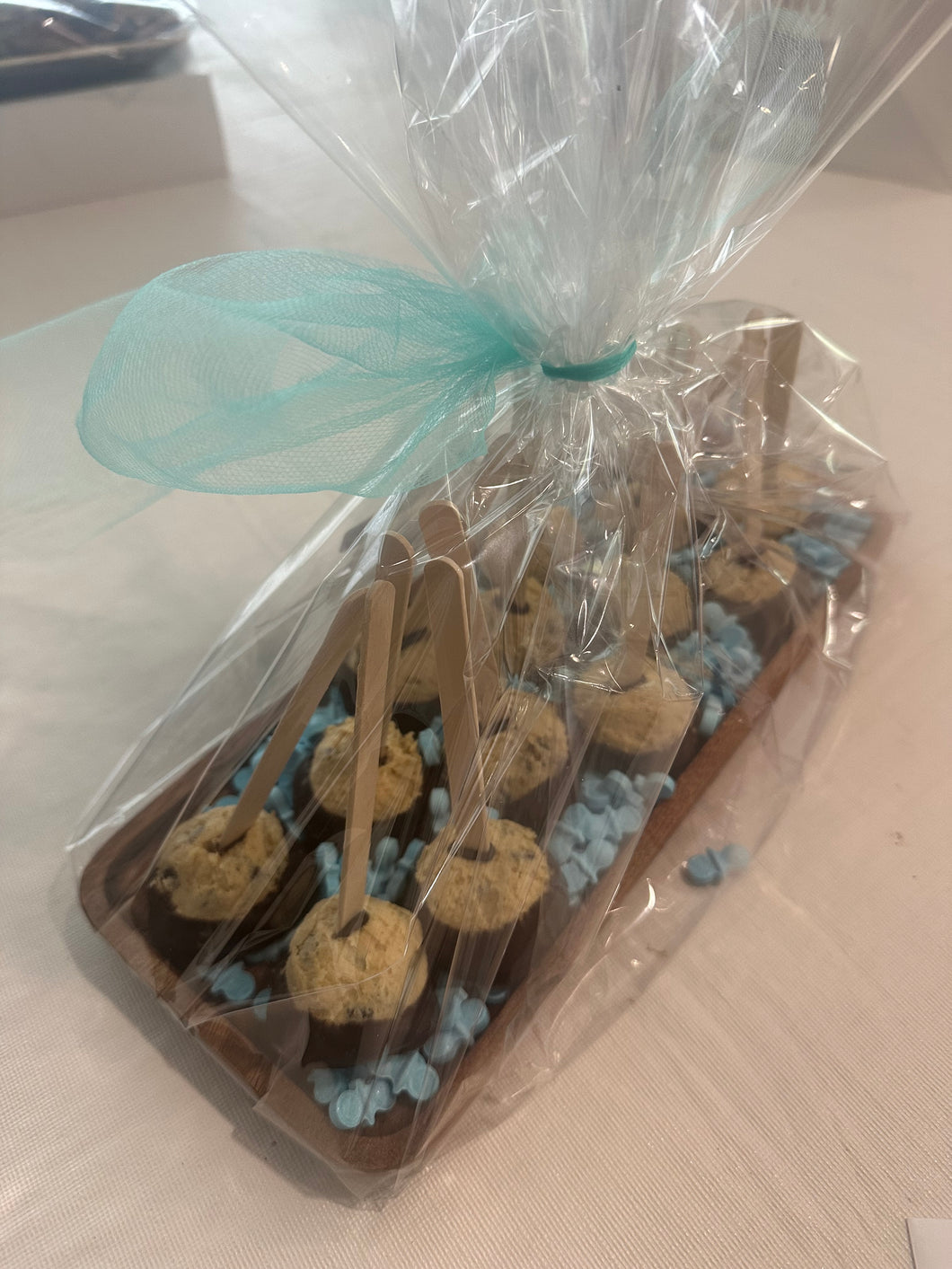 Cookie Dough Pops on wood tray